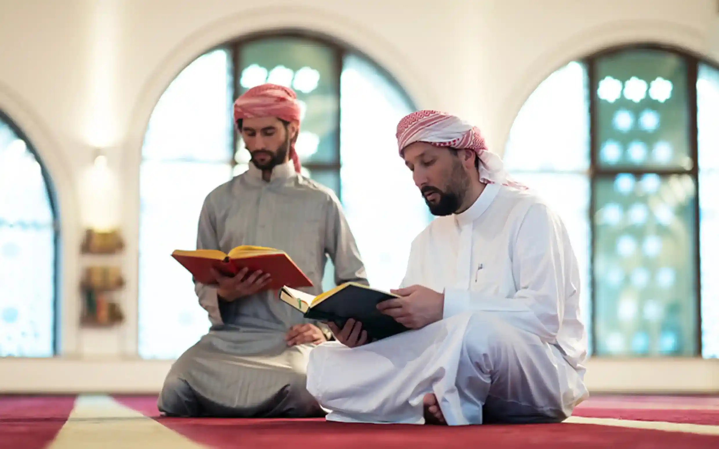Two men reading scriptures