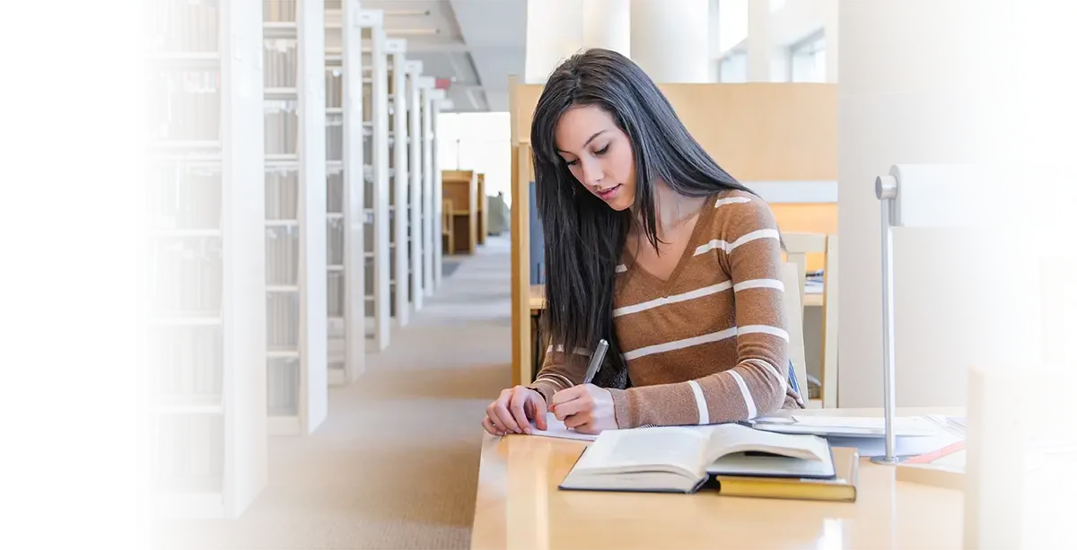 Woman doing research in a library