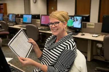 Photograph of a woman making a discovery in an affiliate library.