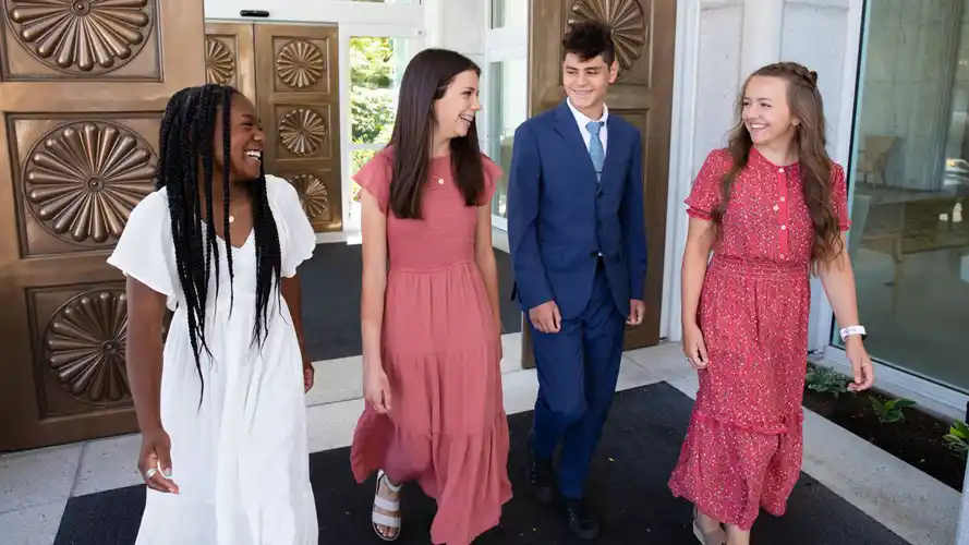 A group of joyful youth at the temple.