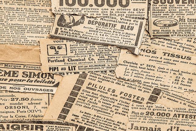 A pile of newspaper clippings